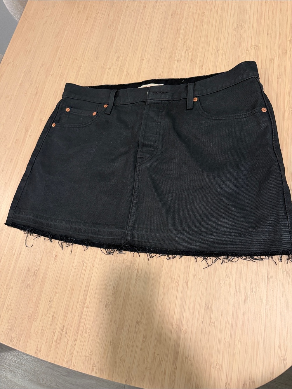 Levi's Black Coated Denim Mini Skirt with Raw Hem